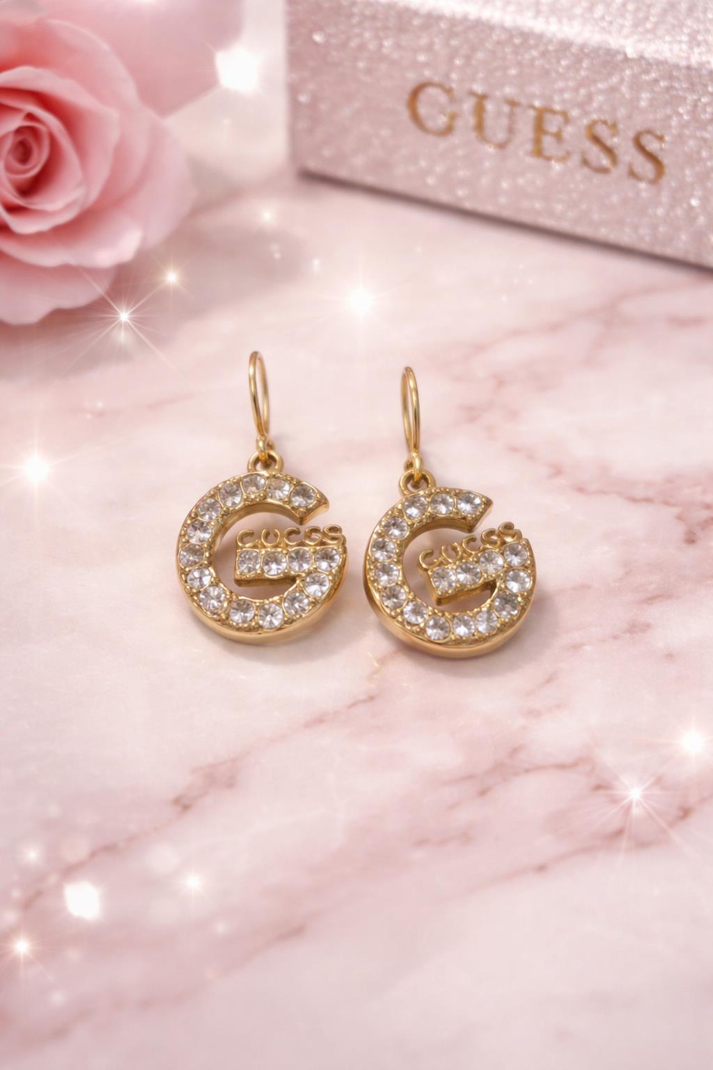 orecchini dorati in acciao lettera G Guess